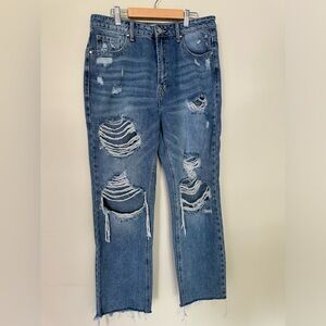 Risen Jeans. Distressed straight leg jeans. Medium wash.